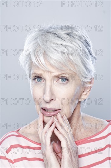 Portrait of worried senior woman, studio shot. 
Photo: Rob Lewine