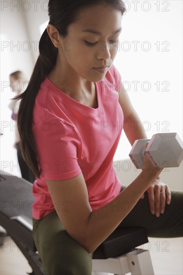 Young woman exercising. 
Photo: Rob Lewine