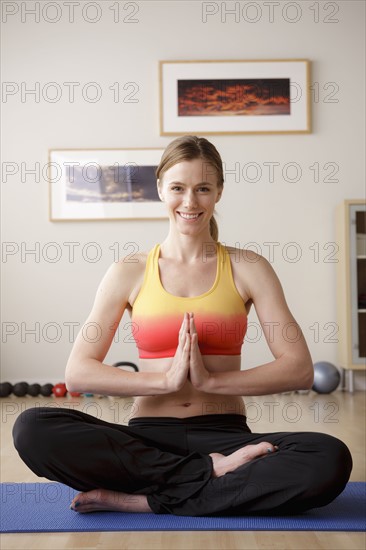 Young woman meditating. 
Photo : Rob Lewine