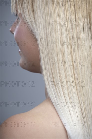 View of woman with blonde hair, studio shot. 
Photo: Mark de Leeuw