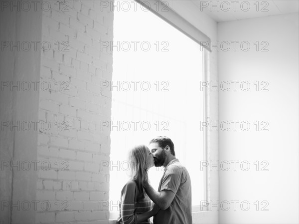 Young couple kissing. 
Photo: Jessica Peterson