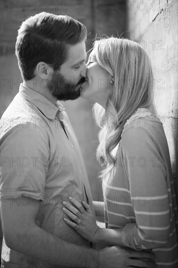 Young couple kissing. 
Photo : Jessica Peterson