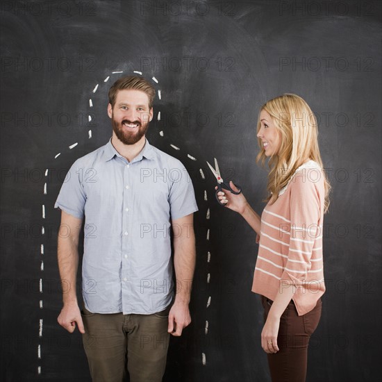 Young couple, man with chalk outline. 
Photo: Jessica Peterson