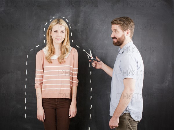 Young couple, man with chalk outline. 
Photo : Jessica Peterson