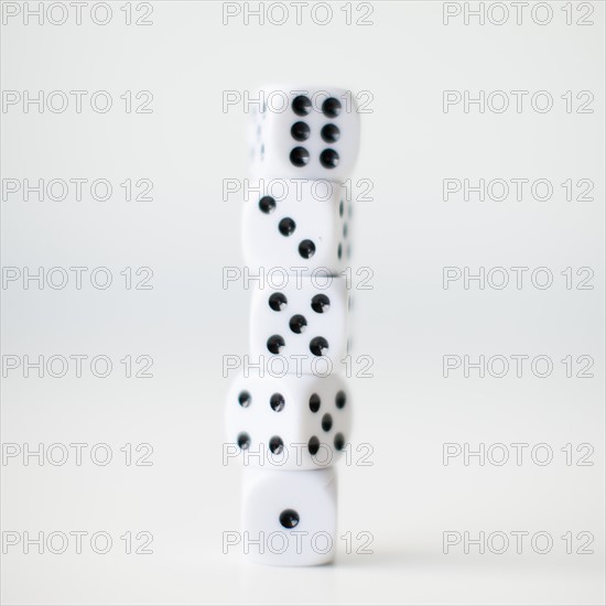 Dices on white background, studio shot. 
Photo : Jessica Peterson