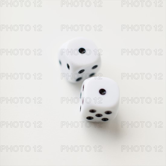 Dices on white background, studio shot. 
Photo : Jessica Peterson