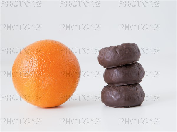 Orange and chocolate cookies on white background, studio shot. 
Photo: Jessica Peterson