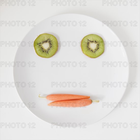 Fruit and vegetable face on plate, studio shot.
Photo: Jessica Peterson