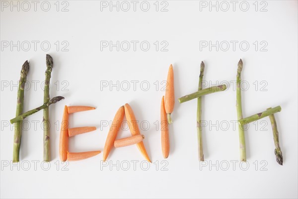 Word 'health' made out of vegetables, studio shot. 
Photo : Jessica Peterson