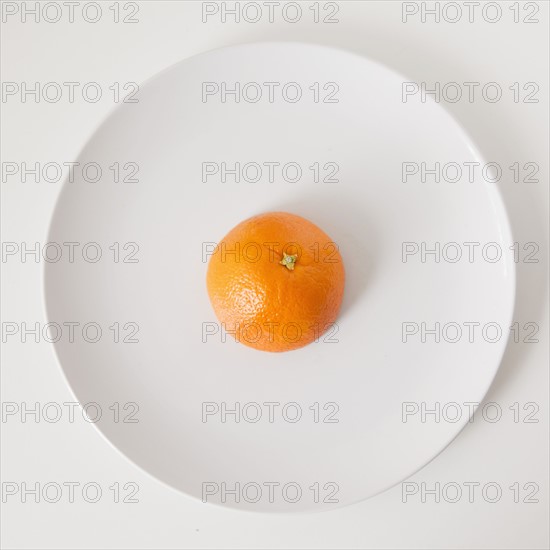 Orange on plate, studio shot.
Photo: Jessica Peterson