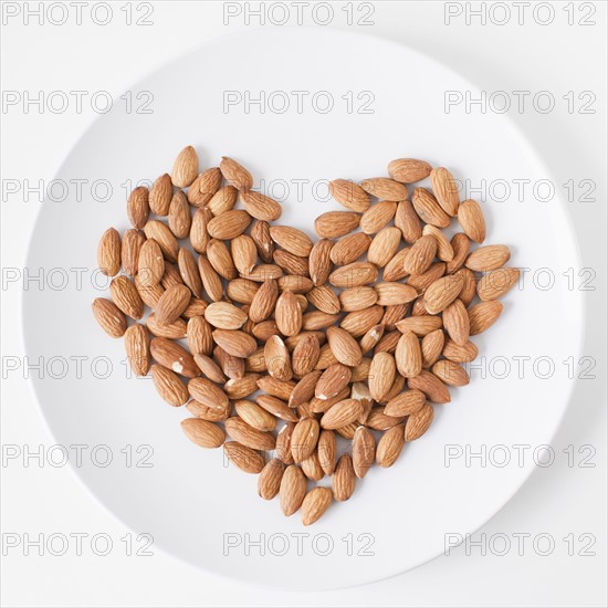 Almonds heart on plate, studio shot. 
Photo: Jessica Peterson