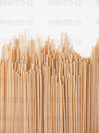 Spaghetti on white background, close-up. 
Photo : Jessica Peterson