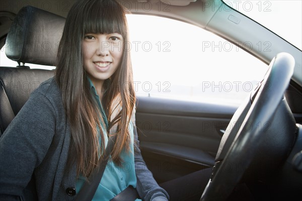 Portrait of young woman in car. 
Photo: Jessica Peterson