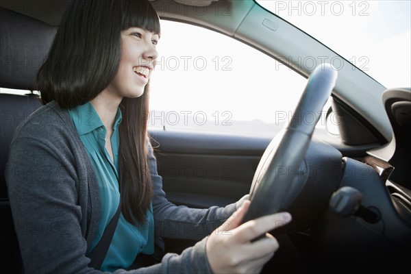 Portrait of young woman in car. 
Photo : Jessica Peterson