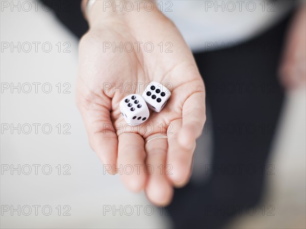 High angle view of hands with dices. 
Photo : Jessica Peterson