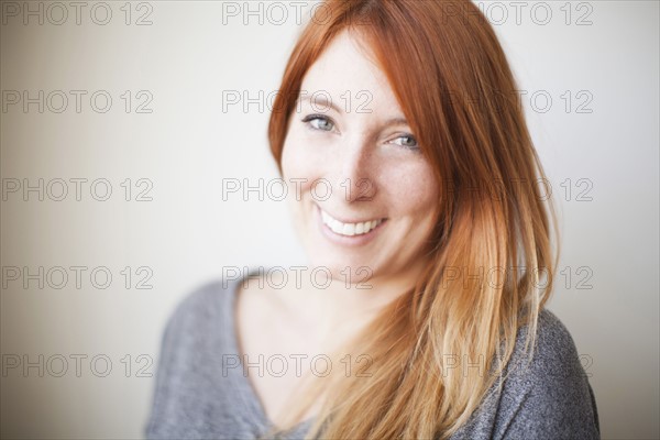 Portrait of attractive young woman with dyed redhead. 
Photo: Jessica Peterson