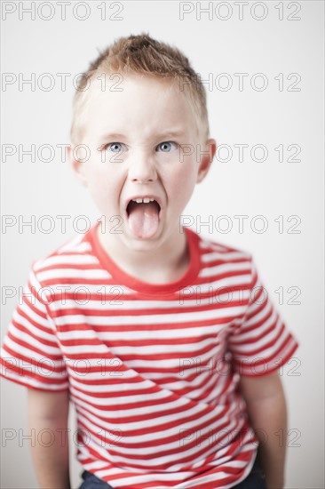 Portrait of toddler boy (2-3) sticking out tongue. 
Photo: Jessica Peterson