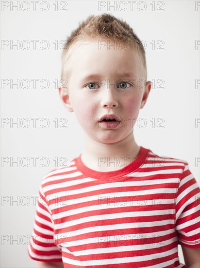 Portrait of disappointed toddler boy (2-3) . 
Photo: Jessica Peterson