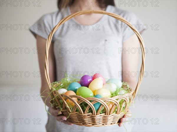 Young woman holding Easter egg basket. 
Photo: Jessica Peterson