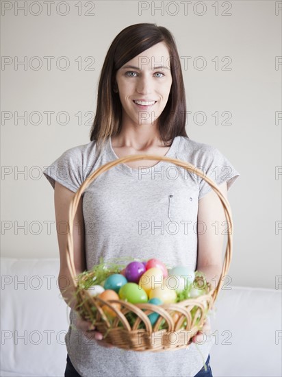 Young woman holding Easter egg basket. 
Photo: Jessica Peterson