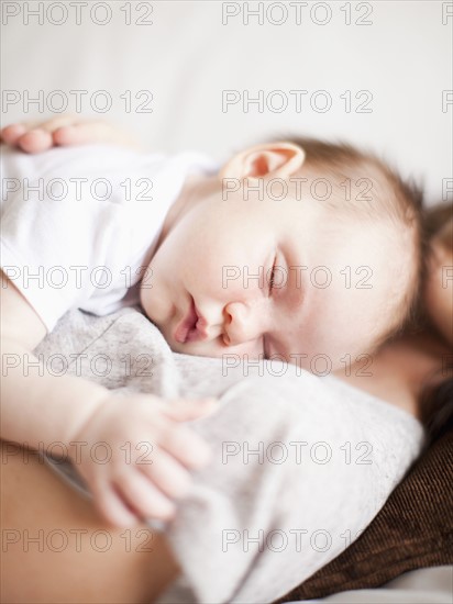 Mother and baby girl (2-5 months) sleeping together. 
Photo: Jessica Peterson