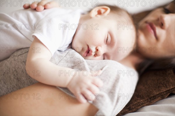 Mother and baby girl (2-5 months) sleeping together. 
Photo: Jessica Peterson