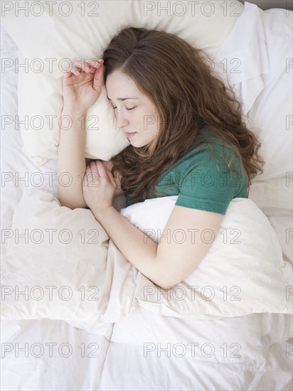 Young woman sleeping in bed.
Photo : Jessica Peterson
