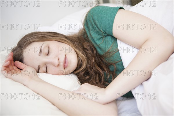 Young woman sleeping in bed. 
Photo : Jessica Peterson