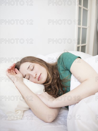 Young woman sleeping in bed.
Photo : Jessica Peterson