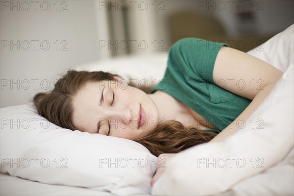 Young woman sleeping in bed. 
Photo : Jessica Peterson