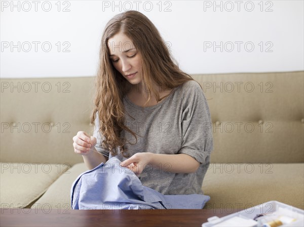 Young woman sawing. 
Photo : Jessica Peterson