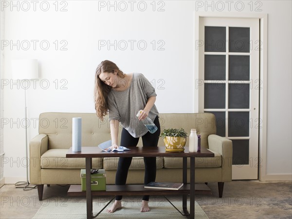 Young woman cleaning. 
Photo: Jessica Peterson