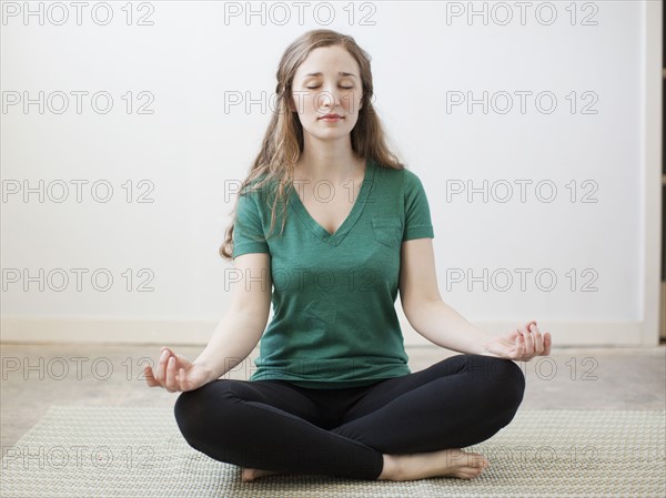 Young woman practicing yoga. 
Photo : Jessica Peterson