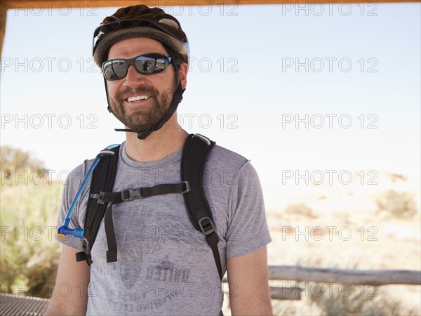 Mid adult man posing in cycling gear. 
Photo : Jessica Peterson