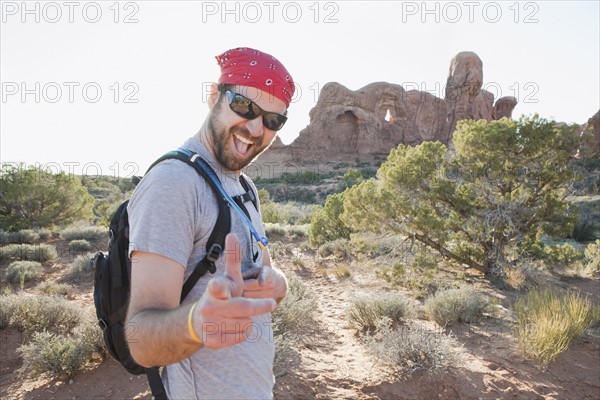 USA, Utah, Moab, Mid adult man posing in remote landscape . 
Photo : Jessica Peterson