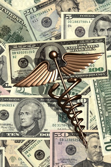 Caduceus and us dollar bills. 
Photo : Calysta Images