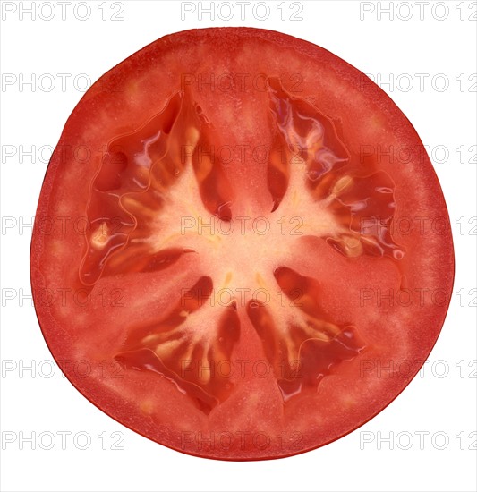 Half of tomato on white background. 
Photo: Calysta Images