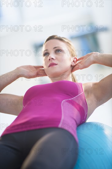 Woman exercising on fitness ball.