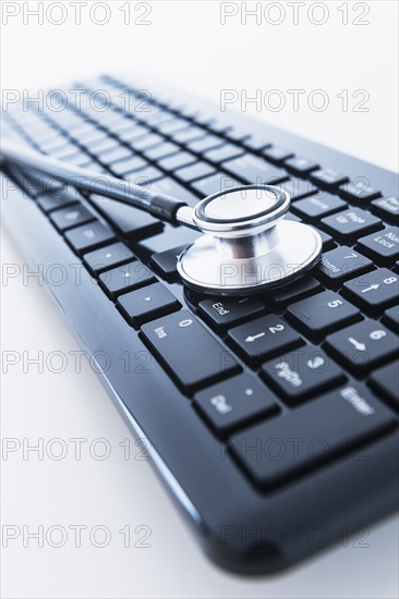 Stethoscope on computer keyboard.