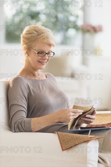 Woman looking at textile swatches.