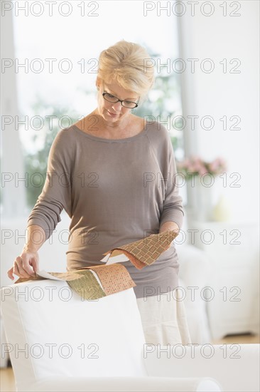 Woman looking at textile swatches.