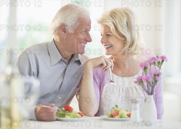 Couple enjoying healthy meal in restaurant.