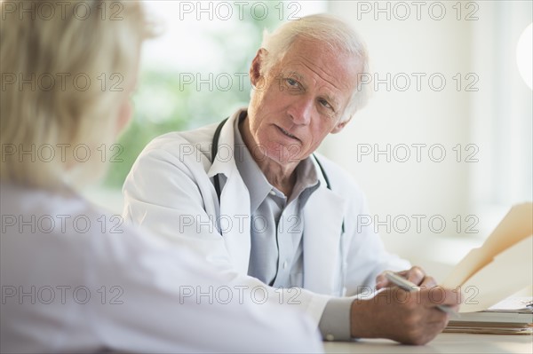 Female and male doctors discussing.