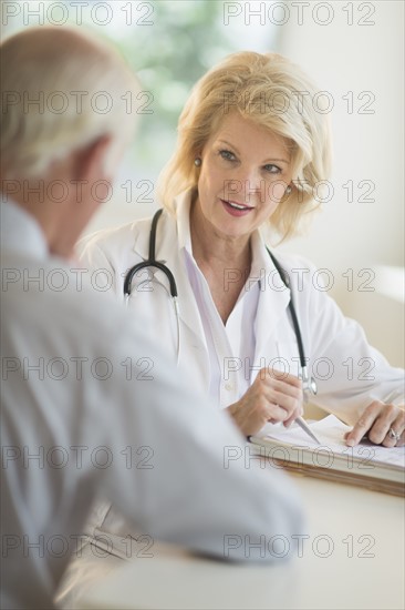 Female and male doctors talking.