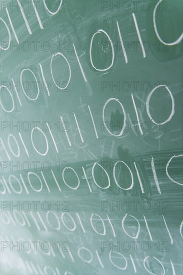 Binary code on blackboard.