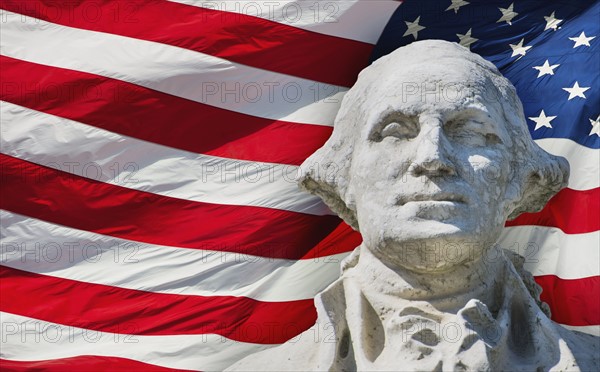 USA, New York City, Washington Square Park, George Washington monument with American flag in background.