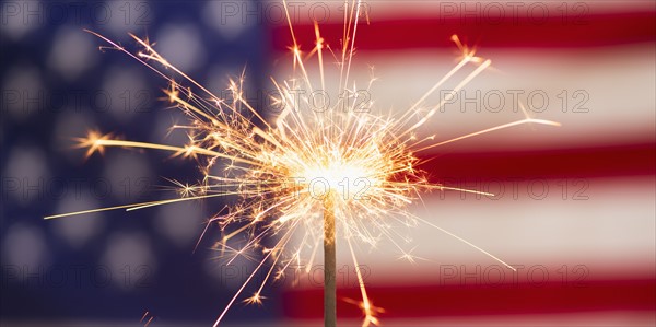 Sparkler and American flag.