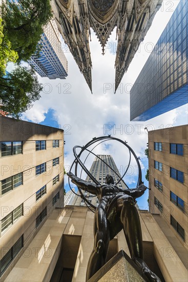 USA, New York City, Low angle view of statue outside Rockefeller Center.