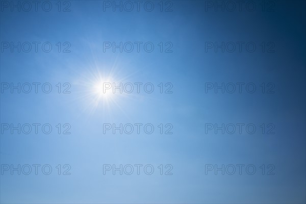 Clear blue sky and solar flare.