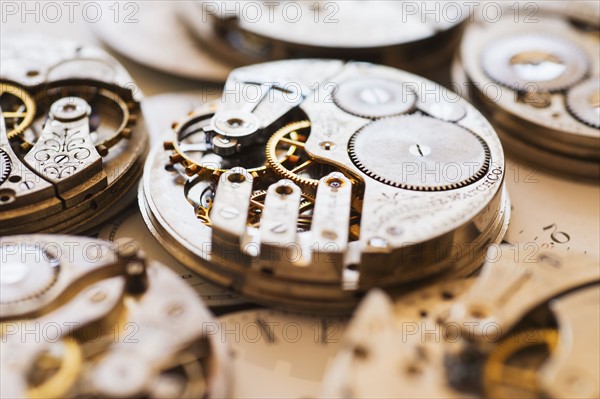 Variety of watches striped to parts.